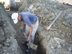 Javier digging trenches for the footers