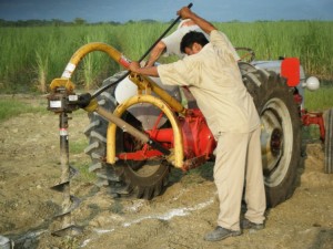 We first loosened up the area to be dug with our post-hole digger