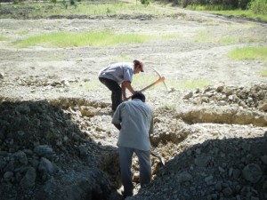 Back-breaking pick and shovel work is the only way to prepare for the footers