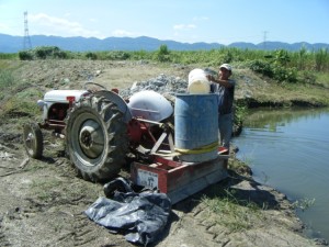 Our multi-use tractor and very useful pond