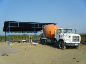 Cement truck ready to begin pouring the floor in the Galera-House