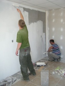 The walls get a primer coat of paint to prepare for the Koinonia 2014 event on Saturday