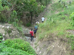 Traversing the pathways of the village. This is how churches are planted - house to house