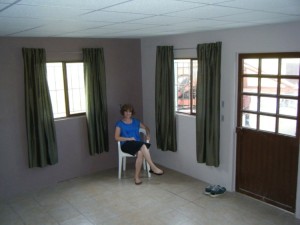Theresa displaying her new curtains in the Casa del Obrero. Pray with us for a staff couple to live here and to begin mentoring missionary trainees