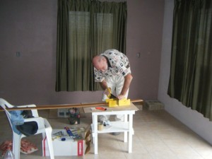 Cutting the baseboard and getting the trim work done in the Casa del Obrero