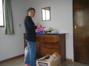 Alicia sets up her bedroom with the first chest of drawers that she has ever owned