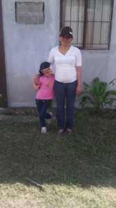 Alicia and Anita standing outside their new home. We are blessed to have this family join the ministry