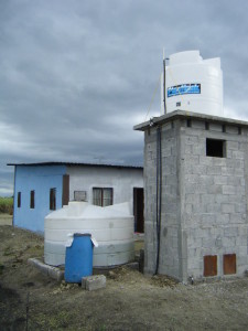 The finished product; and it works like a charm. The well water is pumped into the storage tank, and the house has beautiful water pressure due to gravity flow.