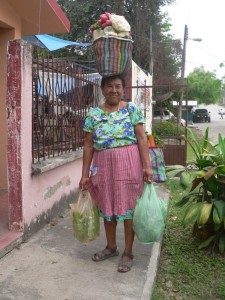 Juana, the little lady who comes by our house to sell fresh vegetables to Theresa. Each of the bags and baskets are very, very heavy, and she is no spring chick any more
