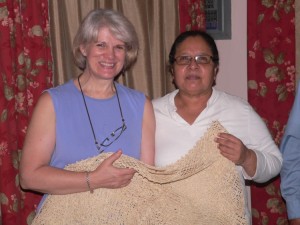 Theresa receives a beautiful, hand-crocheted table cloth from our friend Estela