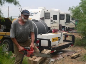 Cutting blocks for bracing supports for the trailer. Our new "pad" in the background. Thank goodness for pop outs that give so much more room inside
