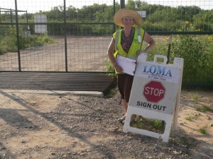 Theresa at her gate guard duty. STOP. There ain't nobody getting past without checking in