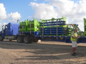 Steven logging in a truck filled with frac pumps and equipment