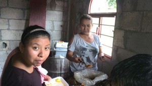 Alicia and another sister serving up zacahuil in the hospital to serve to the poor
