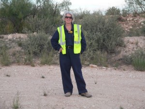 Theresa's glamour shot - fire proof coveralls, steel toed shoes, vest and all. She has taken off her hard hat though