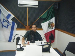 Javier preaching at the mic of the local Christian radio station - Cielos Abiertos