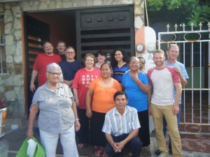 Marty Dyer and the team from Oklahoma stand with hermana Licha in front of her house in Cd. Valles