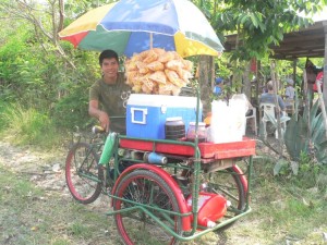 Armando takes a little spin on his father-in-law's mobile raspa (shaved ice) stand