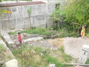 This is the beginnings of Javier and Cristina's personal house. They have the land, but no money to build. It will be done as God provides, but their dream is to get out from the need to pay rent. Javier is doing all of the work himself.