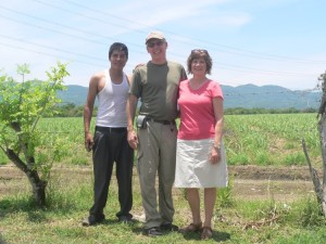 Clinton and Janet Miller with Armando. Those are the Sierra Madre Oriental mountains in the background (standing in the back yard of the Casa del Obrero house)