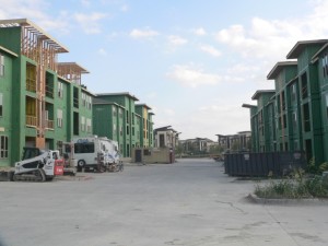 A dwarf among giants. Our little home now nestled at the base of the huge 3-story apartment blocks