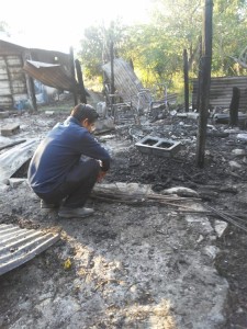 Pastor Javier views ashes of all that remains of children's ministry in Buenos Aires on Friday morning