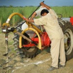 We first loosened up the area to be dug with our post-hole digger