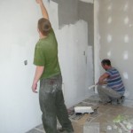 The walls get a primer coat of paint to prepare for the Koinonia 2014 event on Saturday