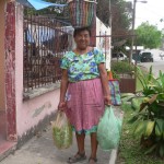 Juana, the little lady who comes by to sell fresh vegetables to Theresa. Each of the bags and baskets are very, very heavy, and she is no spring chick any more
