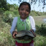 Little Ana holds the turtle that we will be releasing into its new home