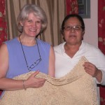 Theresa receives a beautiful, hand-crocheted table cloth from our friend Estela