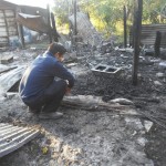 Pastor Javier views ashes of all that remains of children’s ministry in Buenos Aires on Friday morning