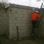 Trinidad at work pouring cement the hard way in the construction at Buenos Aires
