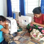 Alicia and her daughter Ana busy at work in the sewing school