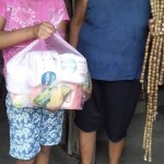 When it became impossible for the children to come to Cristina she went to them. This orphaned child (being raised by her great grandmother) receives a food care-package through the ministry of Hidden Manna.