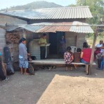 Baking under the sun on a hot day at the new church plant just outsideTanlu